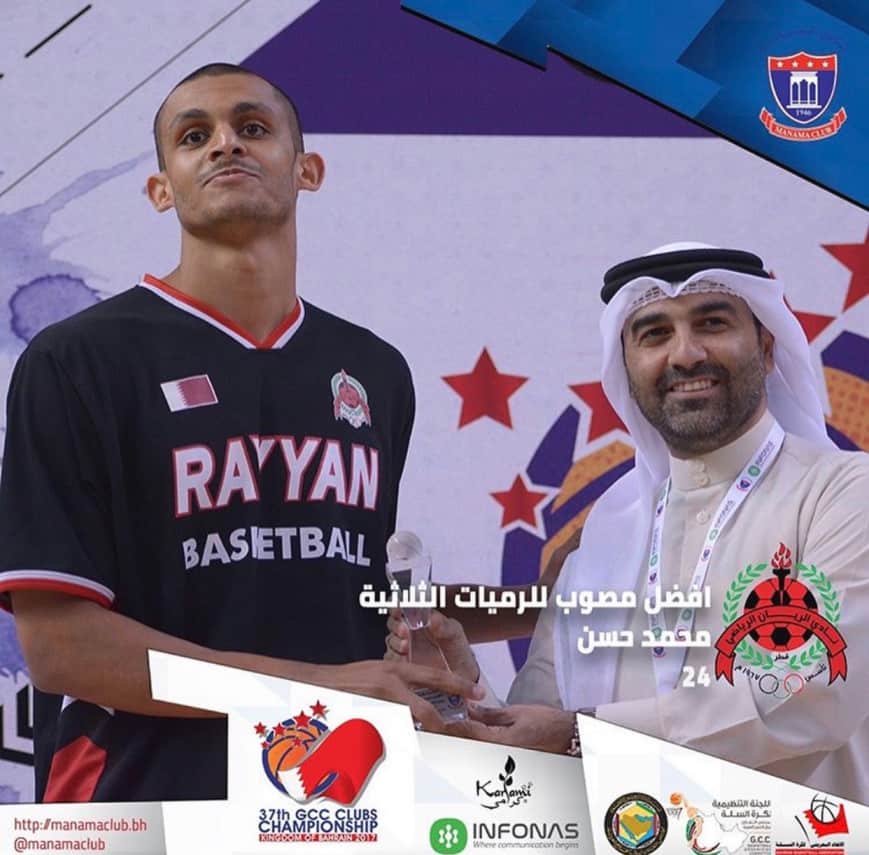 Mizo Amin holding the best 3 point shooter in the gulf region Trophy