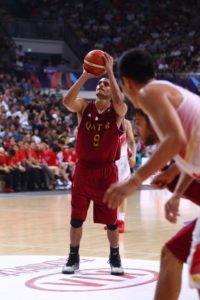 Mizo Amin number 9 holding the basketball shooting free throws